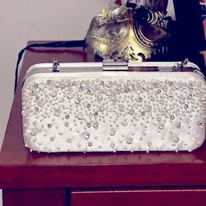 Beautiful beaded off white clutch by Menbur